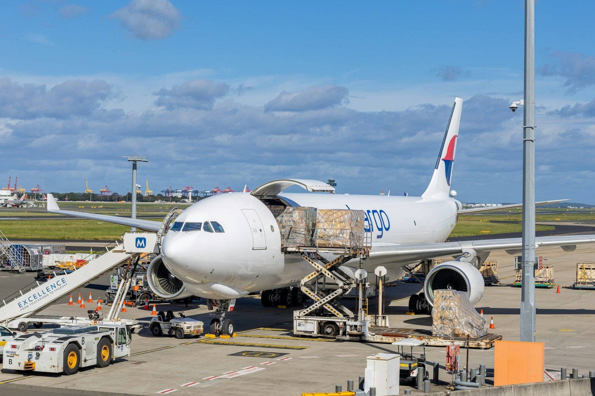 Cargo being loaded onto a freighter aircraft on the airport apron