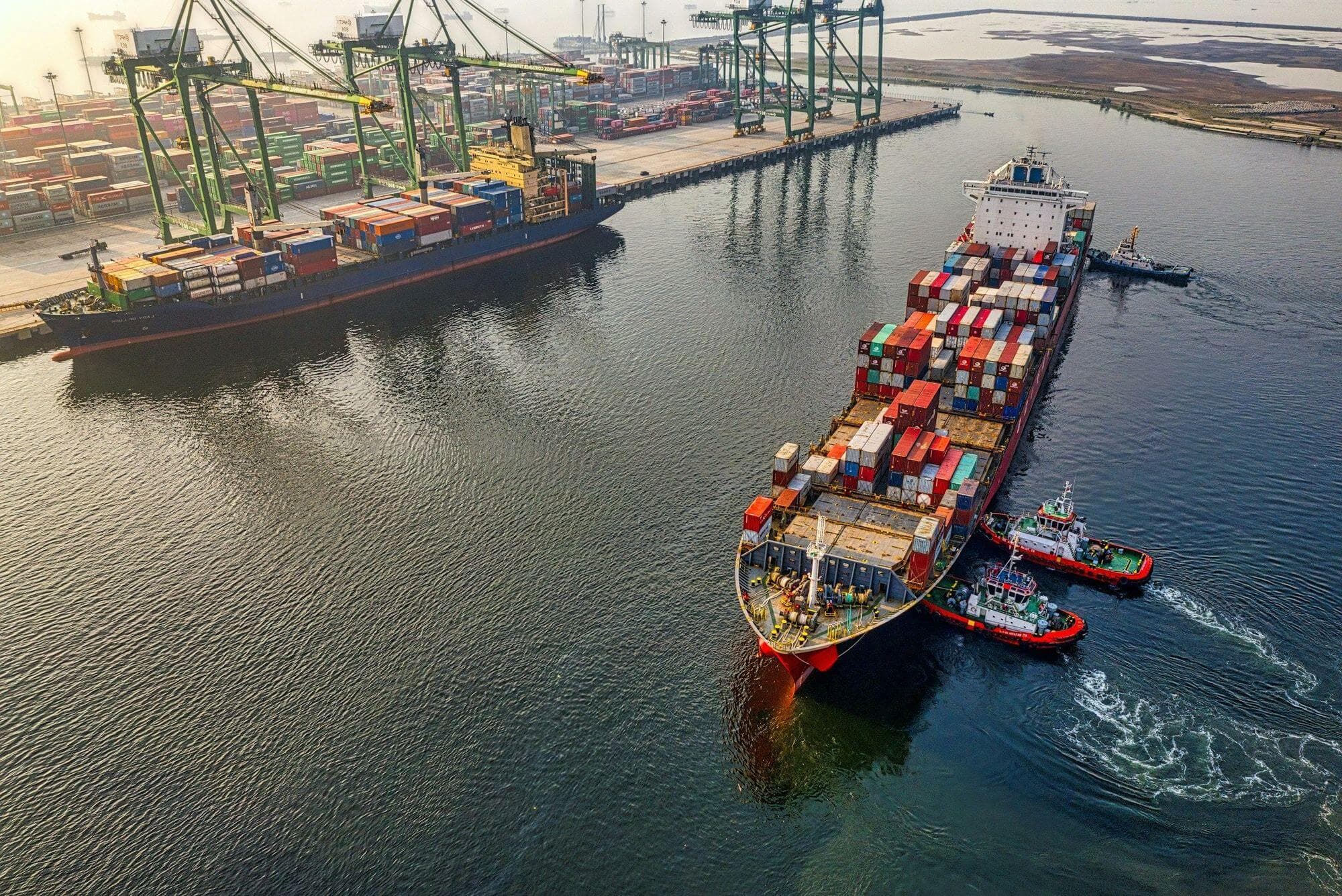 Loaded container ship arriving at a container terminal