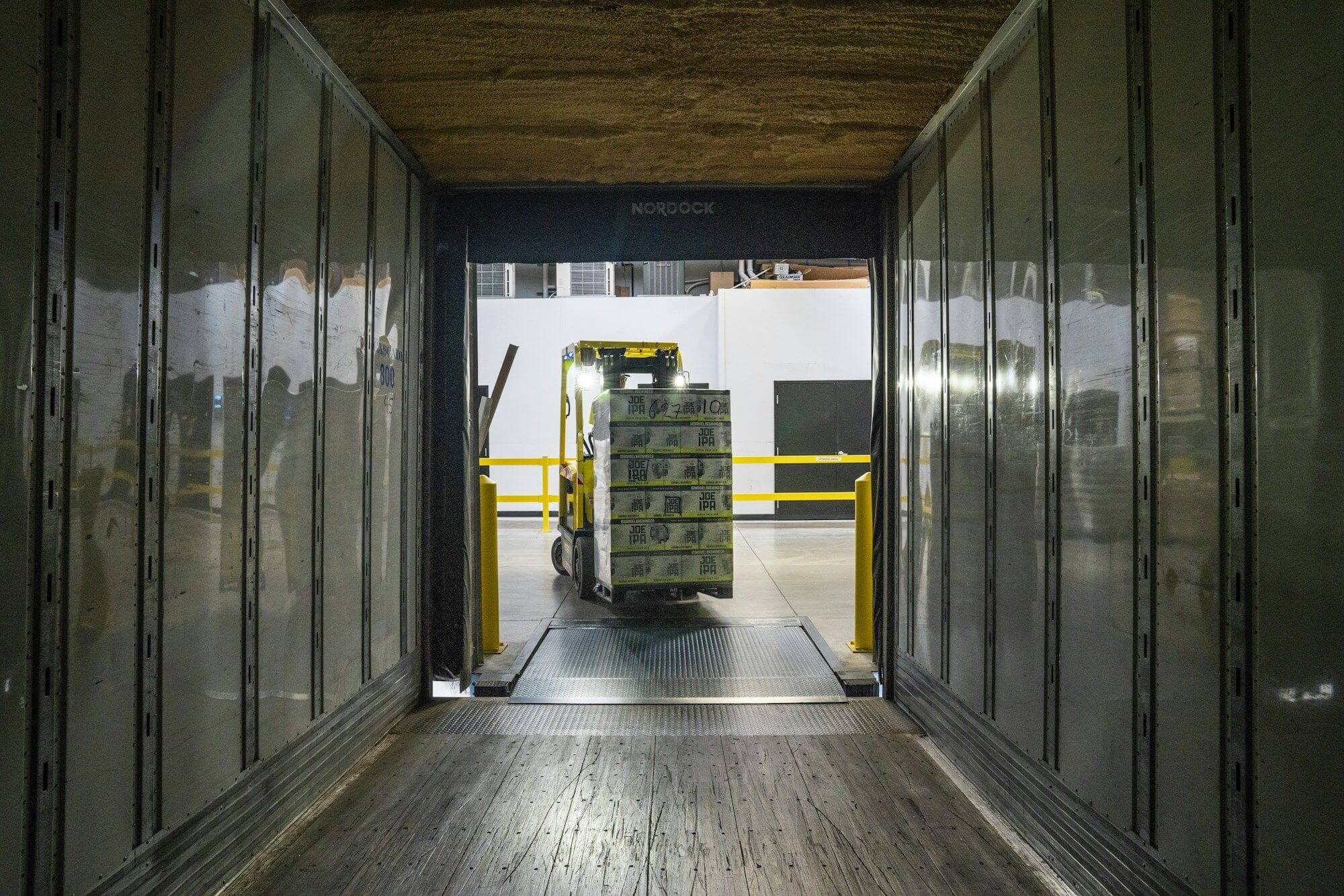 Pallet being loaded into a trailer at a distribution dock