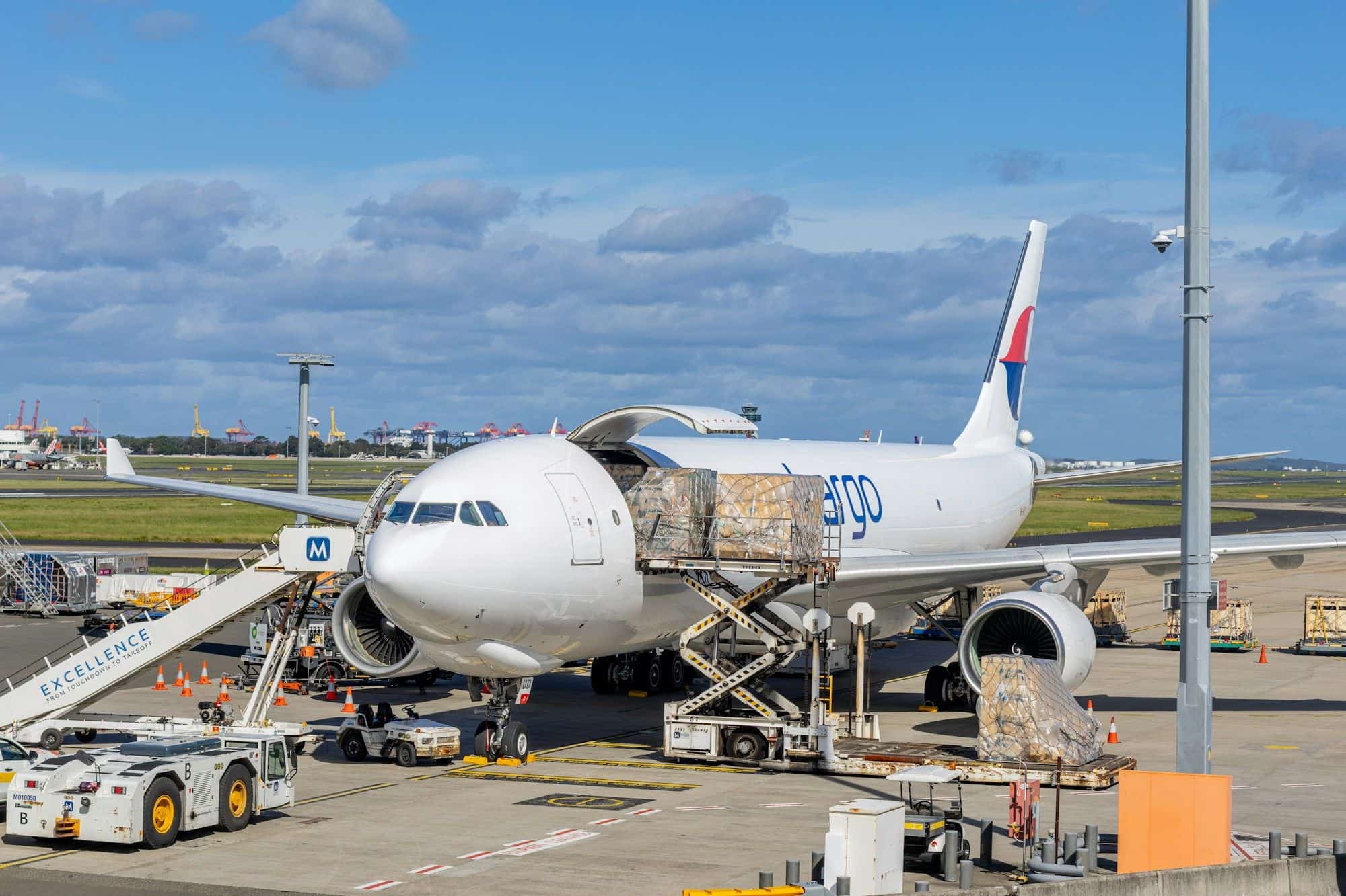 Cargo being loaded onto a freighter aircraft on the airport apron